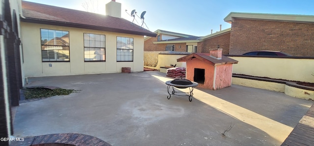 view of patio / terrace featuring a fire pit