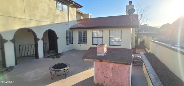 view of patio / terrace with a fire pit