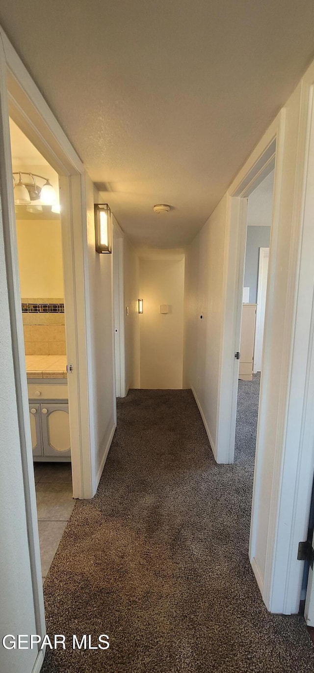 corridor with carpet floors