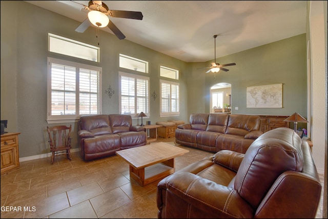 living room featuring light tile patterned floors and ceiling fan