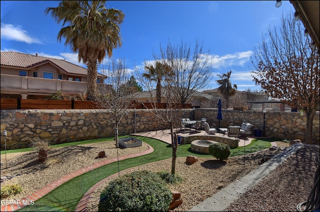 view of yard with a patio and a fire pit