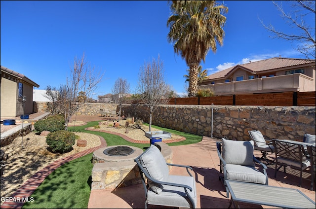 view of patio featuring a fire pit