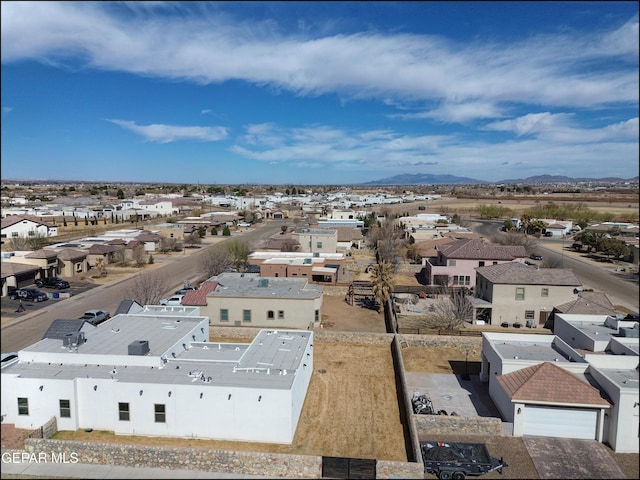 birds eye view of property with a mountain view