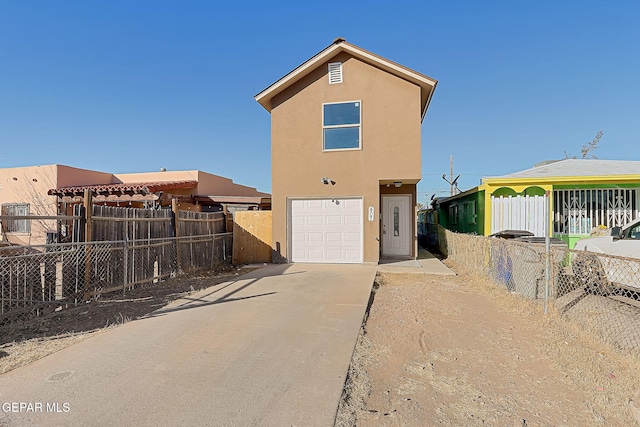 back of house with a garage