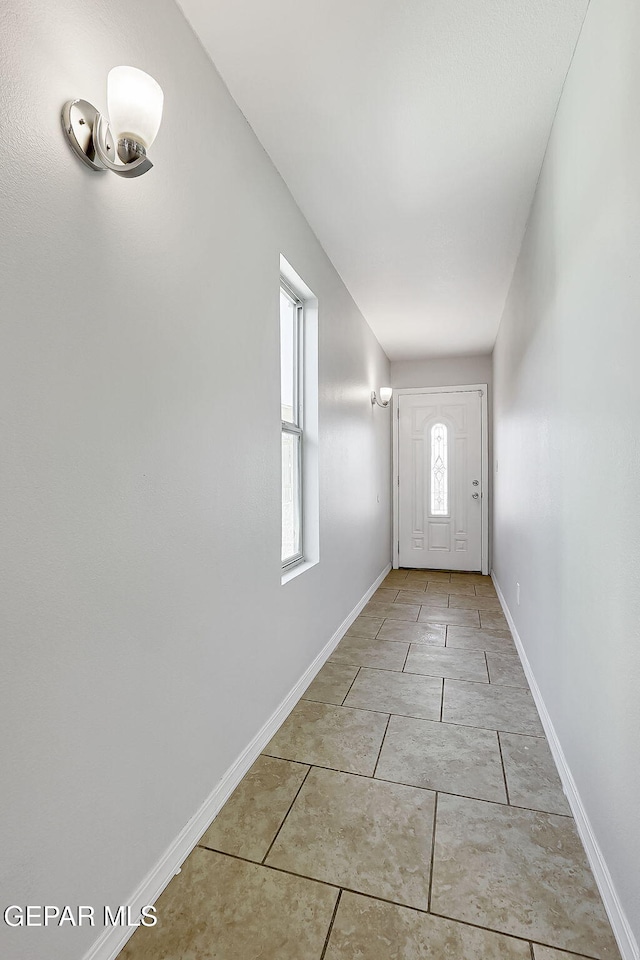 entryway featuring light tile patterned flooring