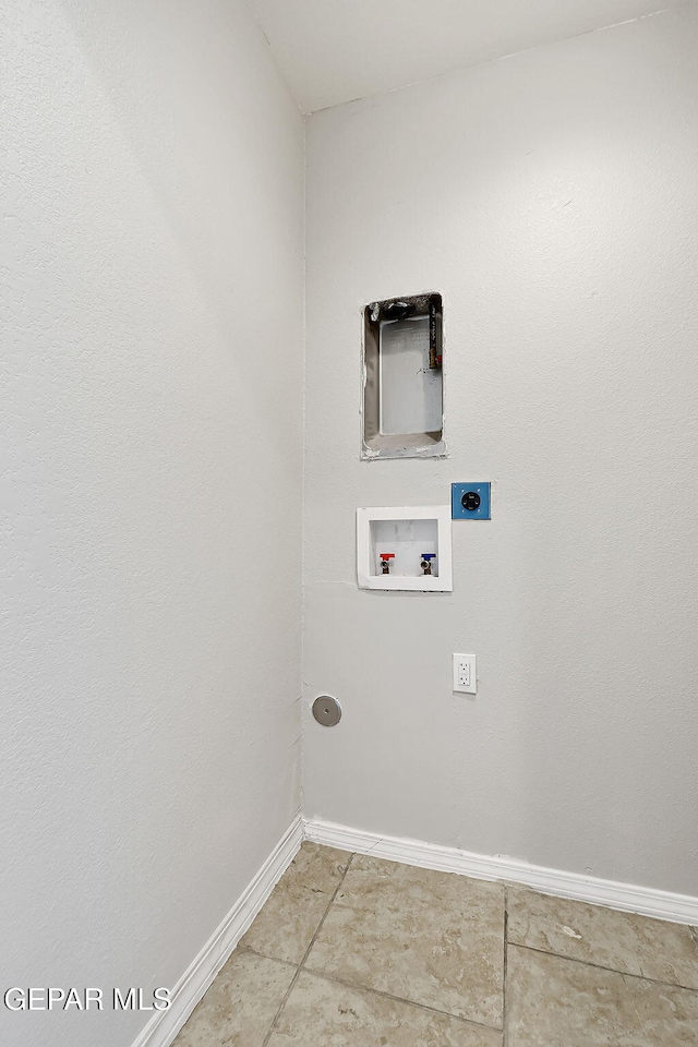 laundry room with hookup for a washing machine, tile patterned flooring, and hookup for an electric dryer