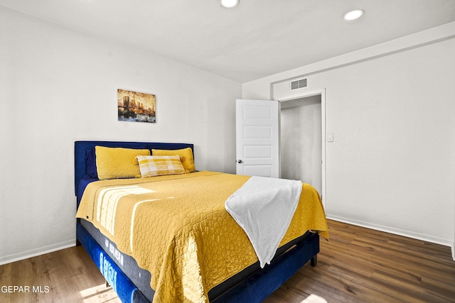 bedroom featuring dark hardwood / wood-style flooring