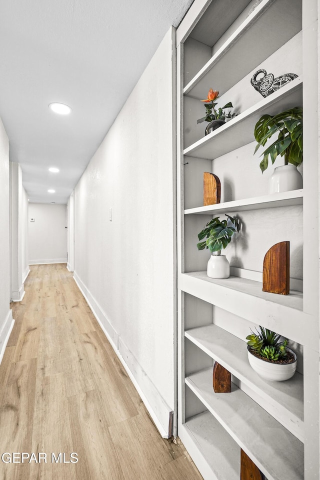 corridor featuring light wood-type flooring