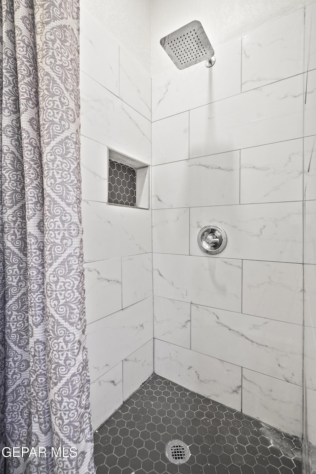 bathroom featuring walk in shower