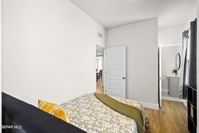 bedroom featuring light hardwood / wood-style floors