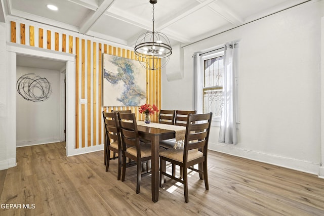 dining area with coffered ceiling, hardwood / wood-style flooring, beamed ceiling, and an inviting chandelier