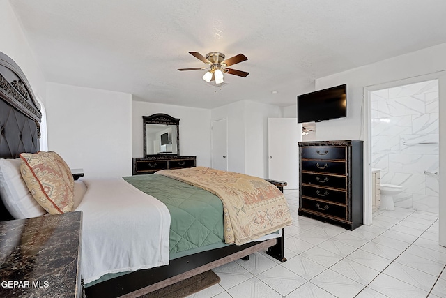 tiled bedroom with a textured ceiling, ceiling fan, and ensuite bathroom