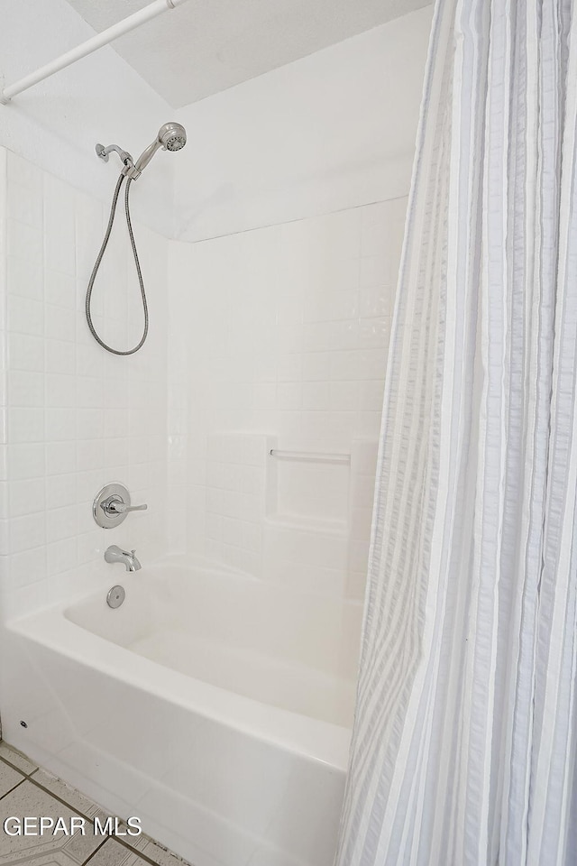 bathroom featuring shower / tub combo and tile patterned floors