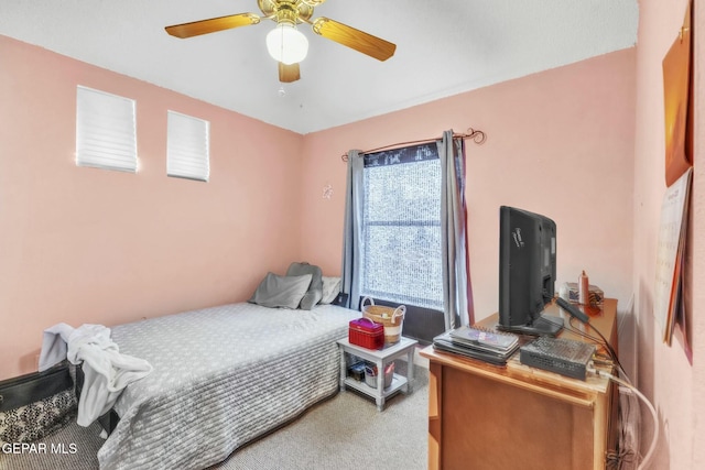 bedroom with ceiling fan and carpet floors