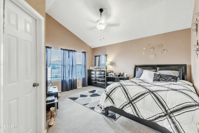 carpeted bedroom with ceiling fan, vaulted ceiling, and a textured ceiling