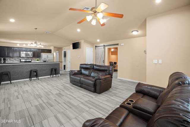 living room with lofted ceiling, a barn door, and ceiling fan