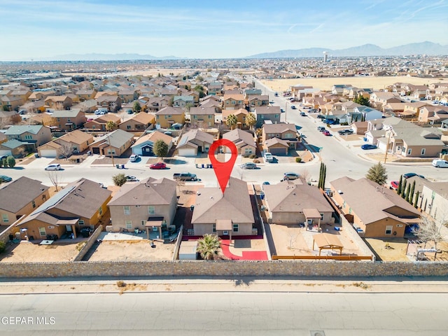 birds eye view of property featuring a mountain view