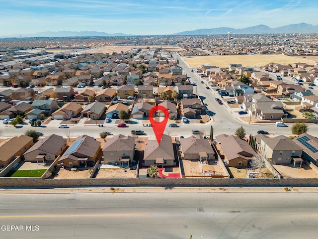 birds eye view of property with a mountain view