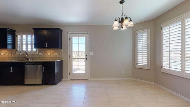 13749 Lorenz Ave, El Paso, TX 79928 - kitchen featuring sink, dishwasher, light stone counters, a notable chandelier, and decorative light fixtures