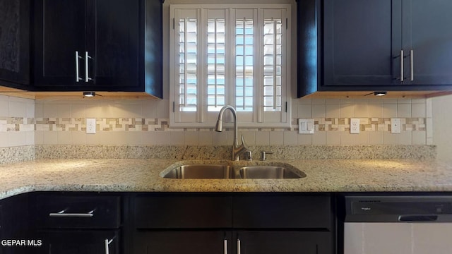 13749 Lorenz Ave, El Paso, TX 79928 - kitchen featuring tasteful backsplash, sink, light stone countertops, and dishwasher