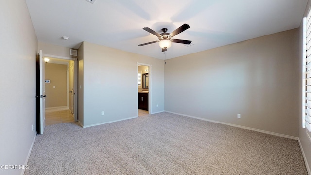 13749 Lorenz Ave, El Paso, TX 79928 - unfurnished bedroom with light carpet, ensuite bath, and ceiling fan