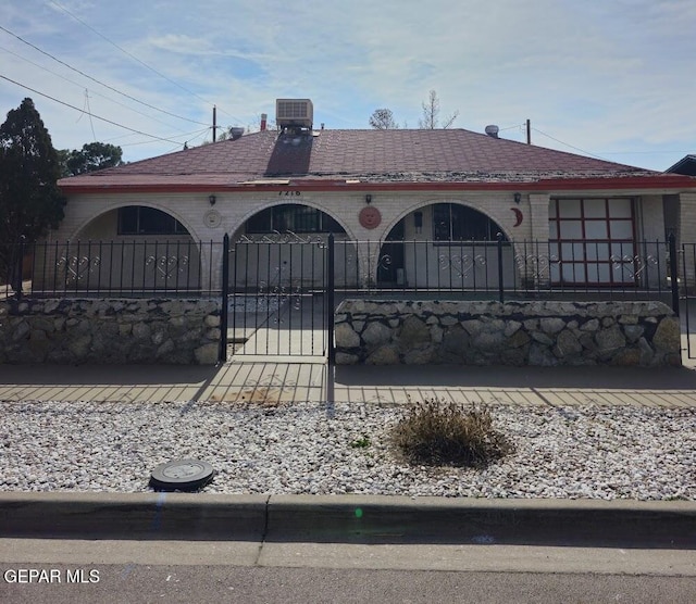 back of house featuring central AC unit