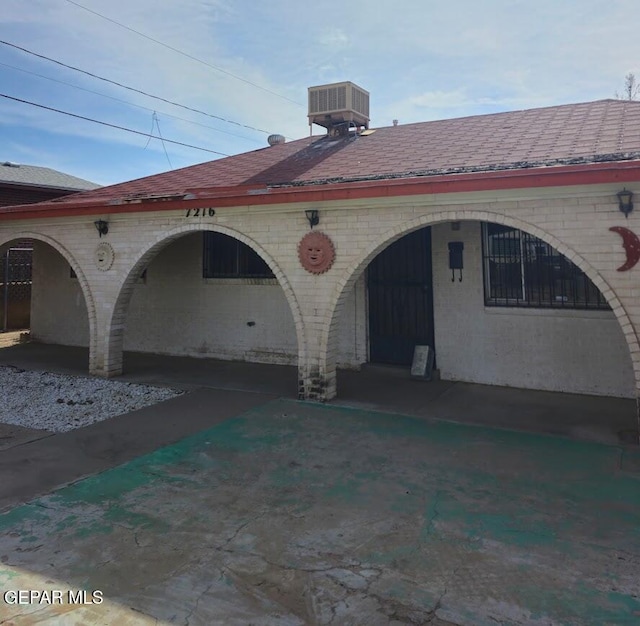 back of property featuring central air condition unit