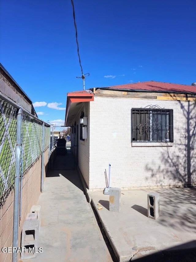 view of property exterior featuring a patio area