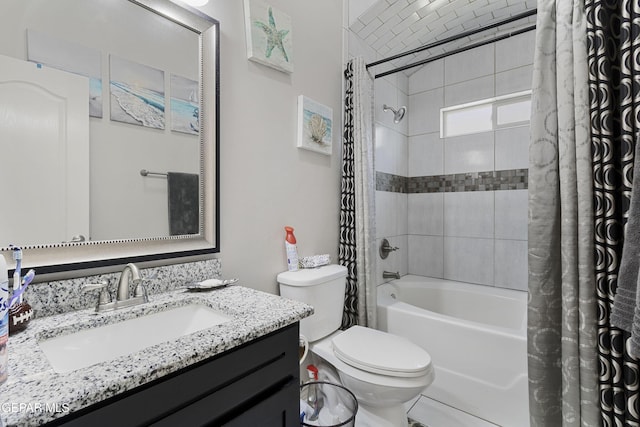 full bathroom featuring vanity, shower / bath combination with curtain, and toilet