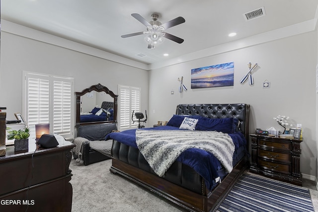 carpeted bedroom featuring ceiling fan