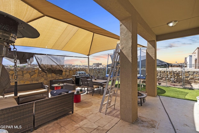 patio terrace at dusk with an outdoor living space