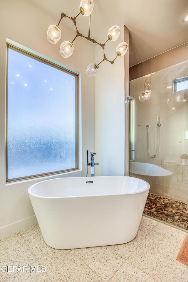 bathroom featuring separate shower and tub