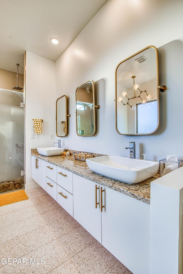 bathroom with vanity and an enclosed shower