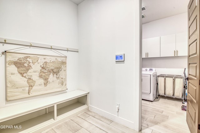 mudroom with washer / dryer and light hardwood / wood-style floors