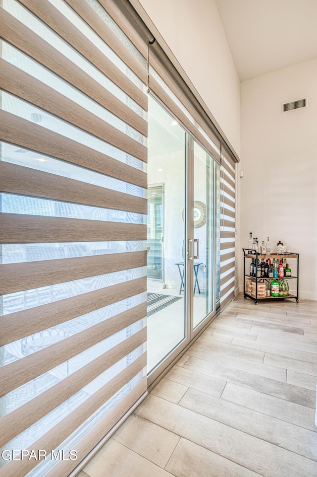 interior space featuring hardwood / wood-style floors and french doors