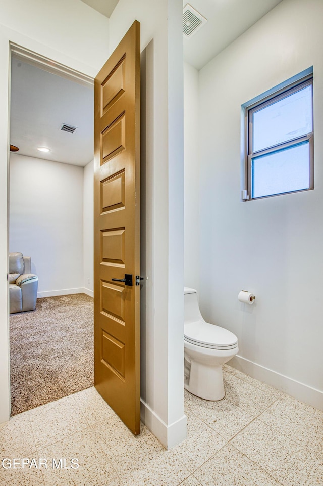 bathroom featuring toilet