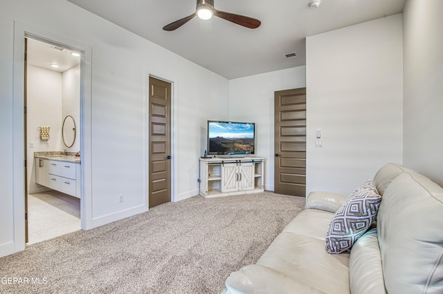 carpeted living room featuring ceiling fan