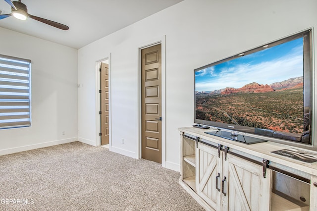 carpeted bedroom with ceiling fan