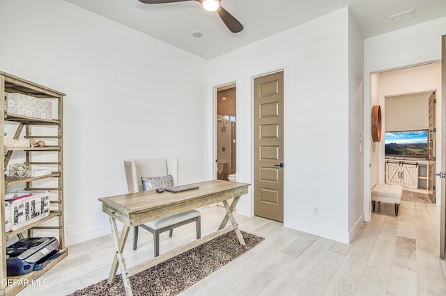 office space with light hardwood / wood-style flooring and ceiling fan