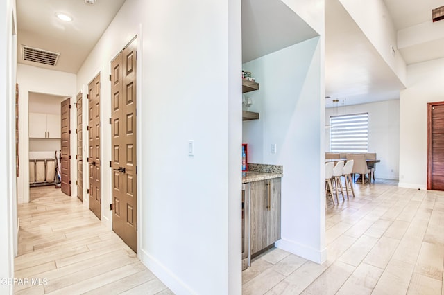 corridor featuring light hardwood / wood-style flooring