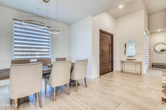 dining area with light hardwood / wood-style flooring