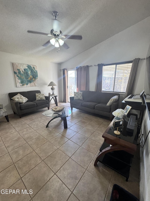 living room with light tile patterned floors, a textured ceiling, a wealth of natural light, and ceiling fan