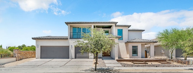 mediterranean / spanish-style house with a garage