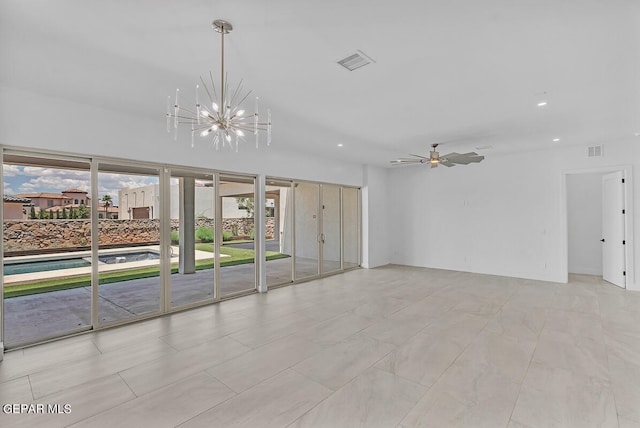 unfurnished room with ceiling fan with notable chandelier