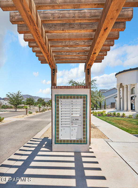 view of property's community with a mountain view and mail boxes