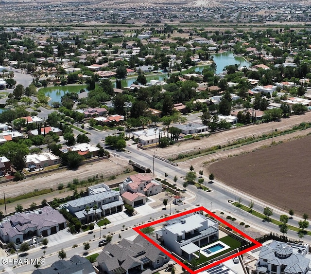 birds eye view of property featuring a water view