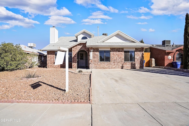 ranch-style home featuring central air condition unit