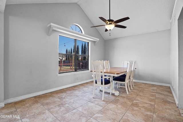 dining room with lofted ceiling, light tile patterned floors, and ceiling fan