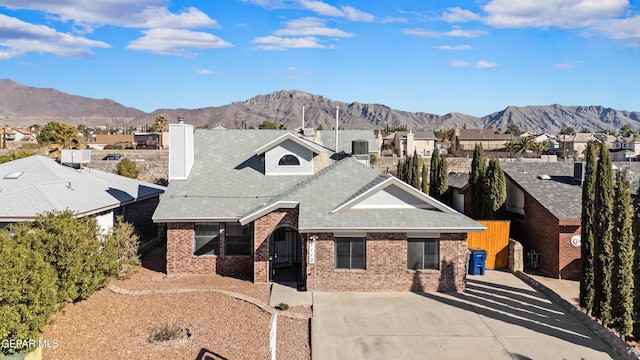 exterior space featuring a mountain view and central AC unit