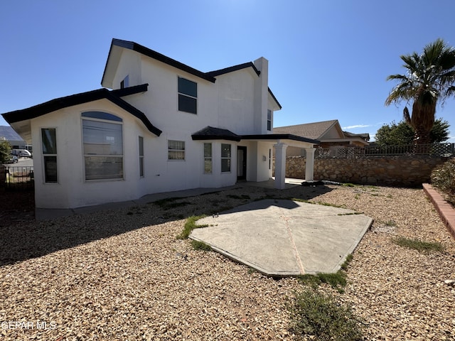 back of house featuring a patio